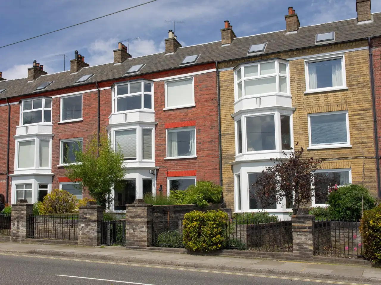 Row of UK terraced houses with bay windows