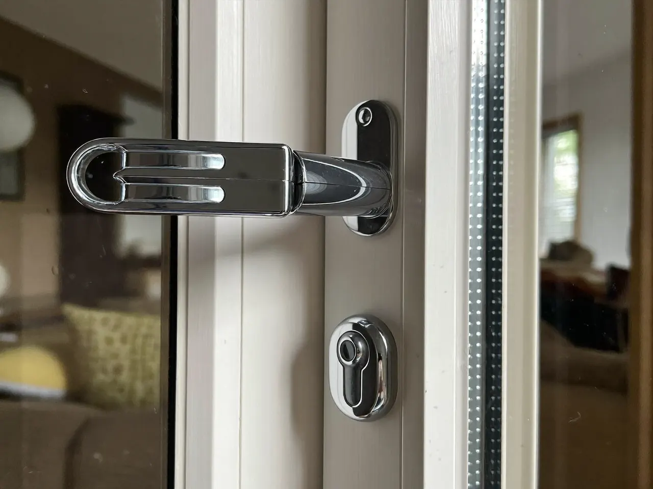 Close-up of a multipoint window handle and lock
